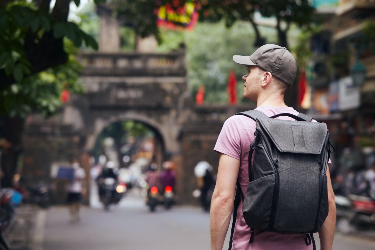 traveler-walking-on-busy-street-in-hanoi.jpg